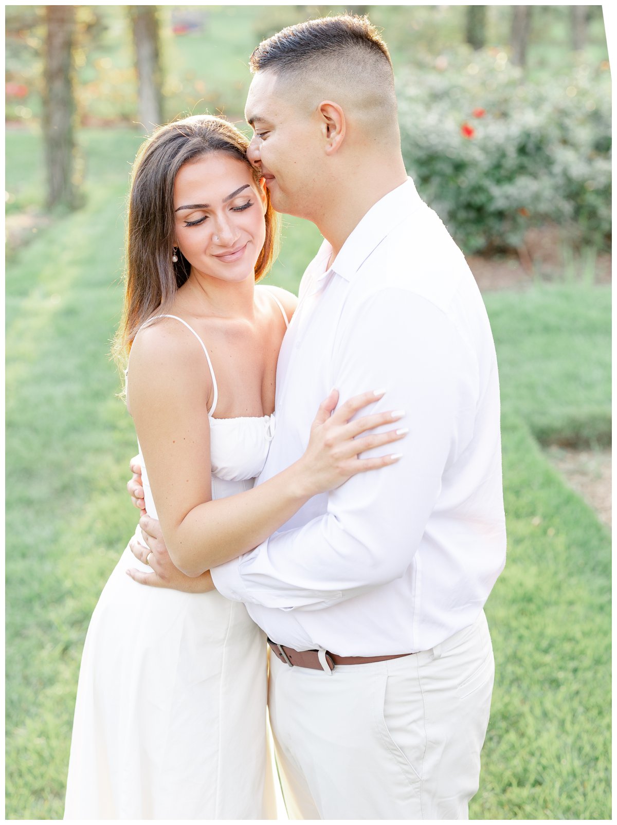 Newport Wedding Photographer and Videographer | Serving CT, RI, Massachusetts, and Surrounding New England Areas | Couple holding hands | Couple embracing at the garden