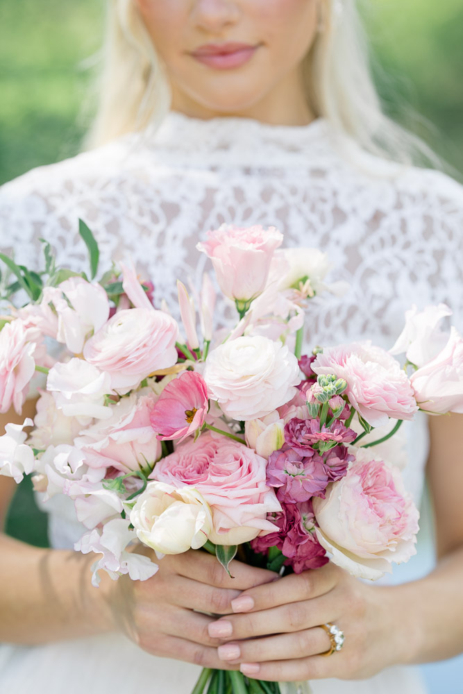 Newport RI Wedding Photographer and Wedding Videographer | Serving CT, RI, and New England Areas | Bride holding a pink floral bouquet