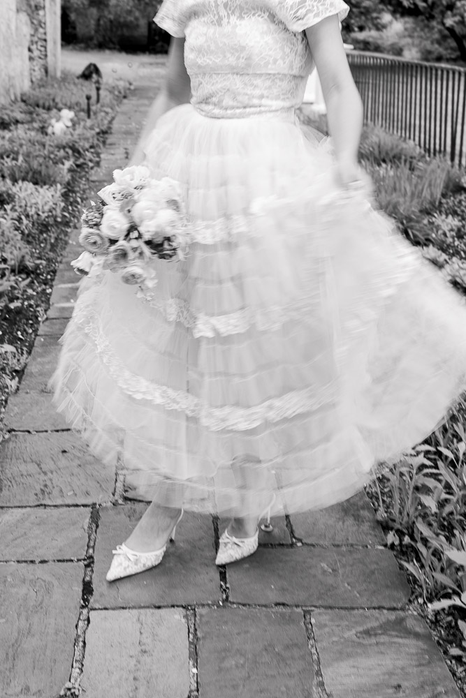 Newport RI Wedding Photographer and Wedding Videographer | Serving CT, RI, and New England Areas | Bride holding up her lace gown