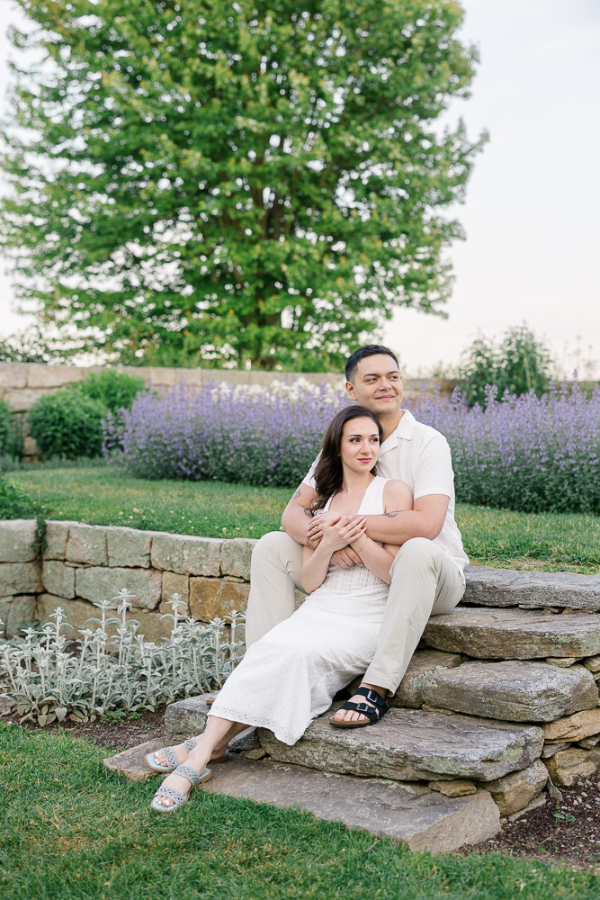 Couples Photographer CT and Wedding Videographer | Serving Newport, RI, and New England Areas | Couple sitting on the stairs while embracing