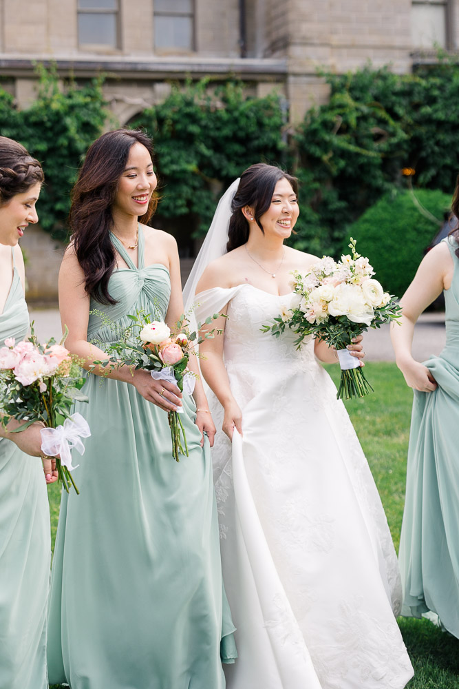 Newport RI Wedding Photographers and Wedding Videographer | Serving CT, RI, and New England Areas | Bride with bridesmaids holding bouquets