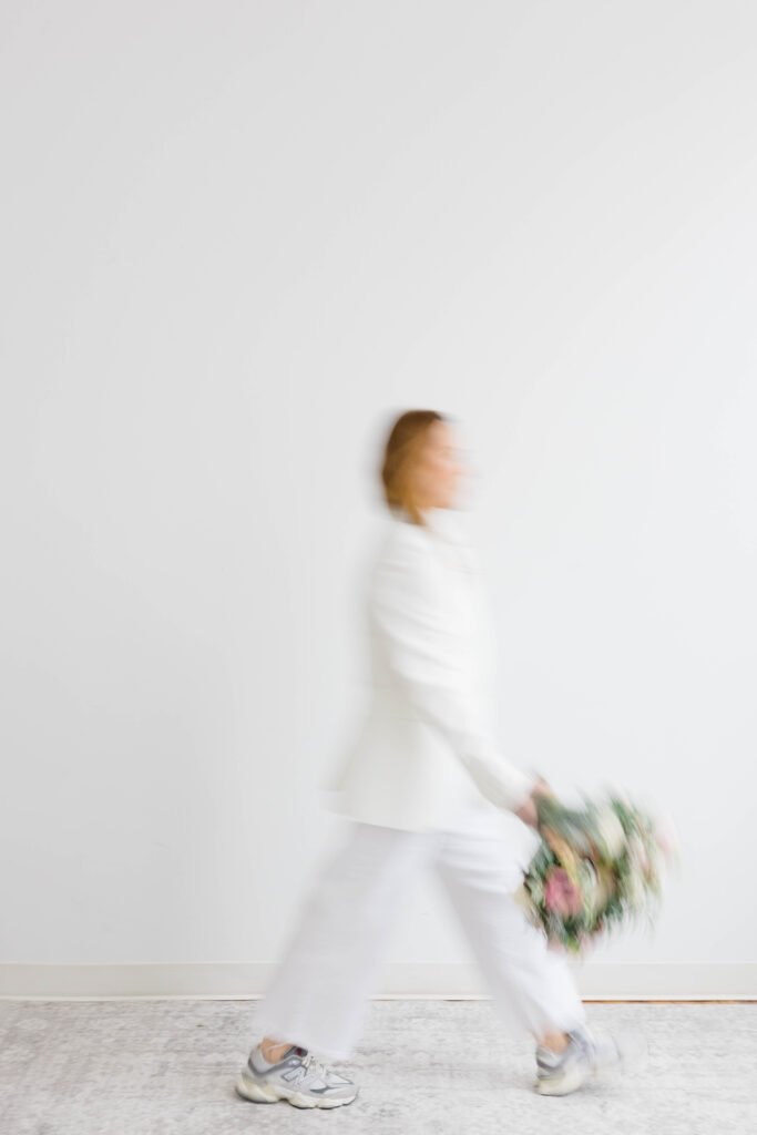 Branding Photographer CT and Videographer | Serving Newport, RI, and New England Areas | Woman walking for studio branding shoot with blur effect