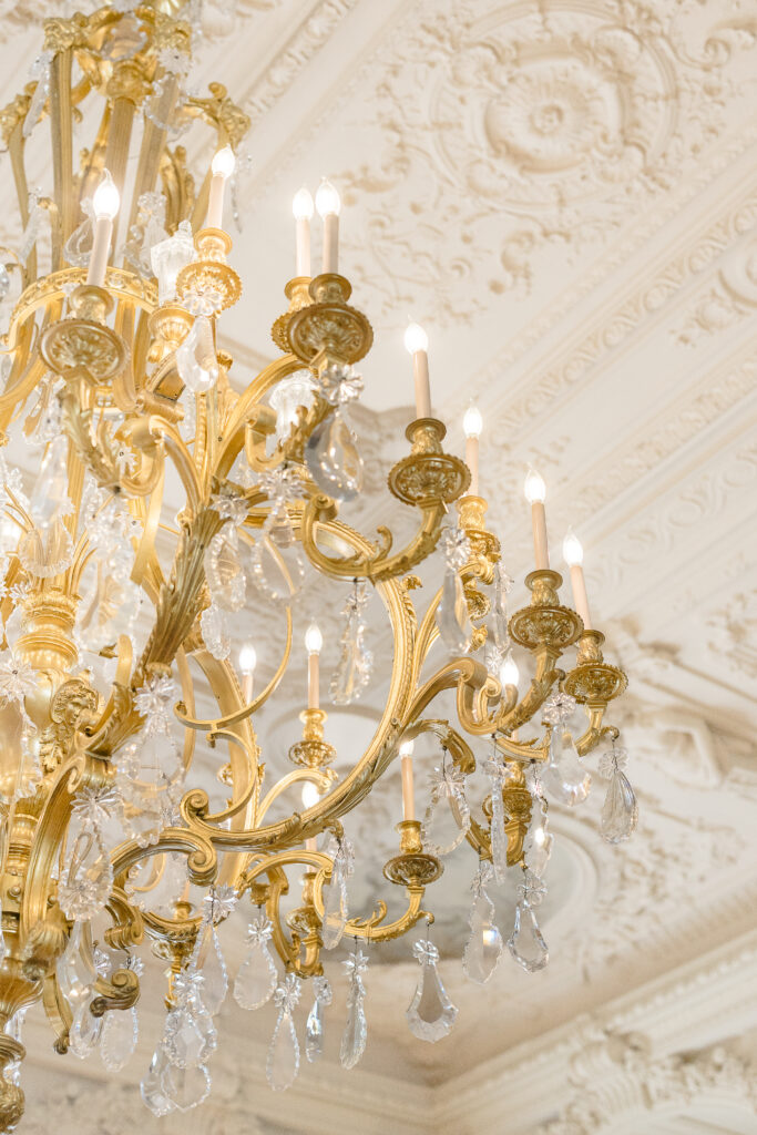 Newport RI Wedding Photographers and Wedding Videographer | Serving CT, RI, and New England Areas | Chandelier at the Rosecliff Mansion wedding venue