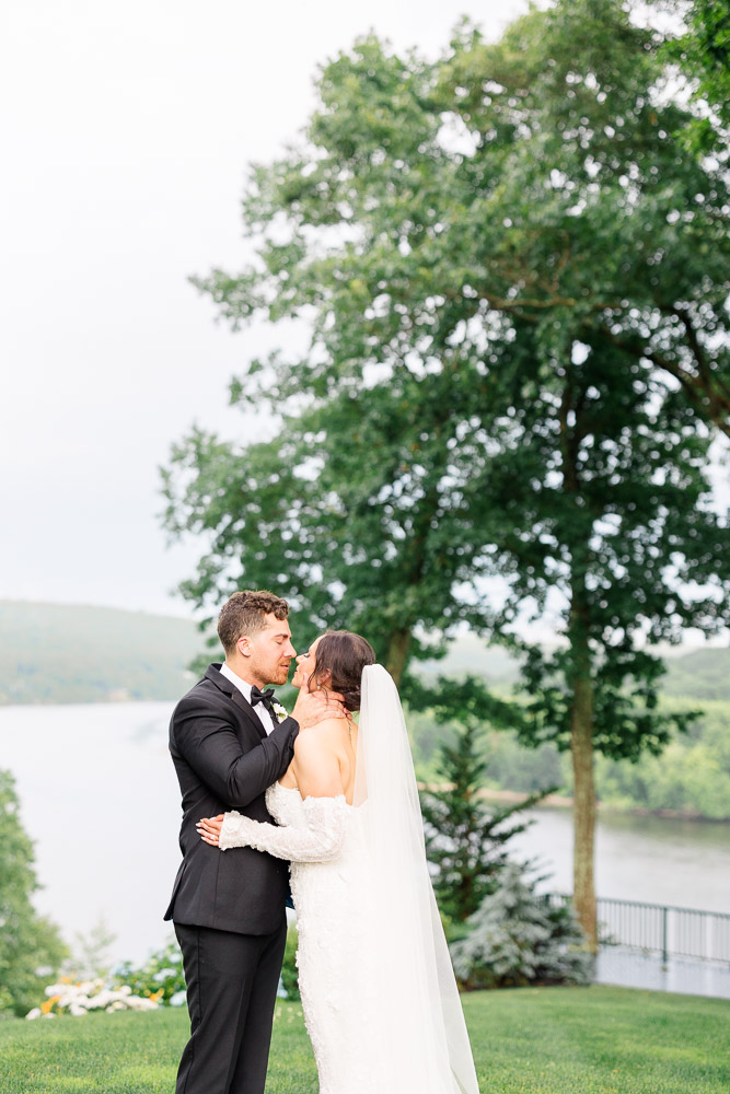 Newport Wedding Photographer and Wedding Videographer | Serving CT, RI, and New England Areas | Bride and groom embracing