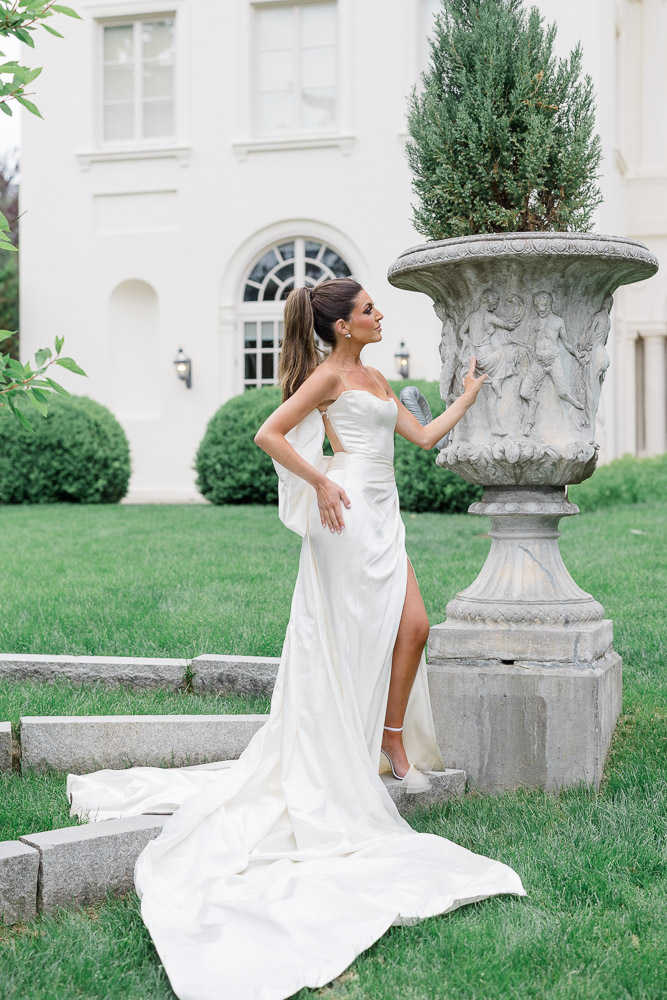 Wedding Photographers and Video CT | Serving Newport, RI, and New England Areas | Bride standing by a sculpture at the Wadsworth Mansion