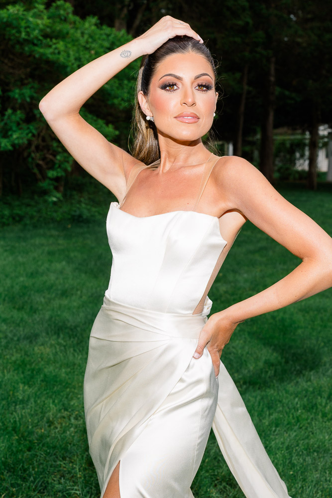 Newport Wedding Photographer and Wedding Videographer | Serving CT, RI, and New England Areas | Bride standing in a field of grass