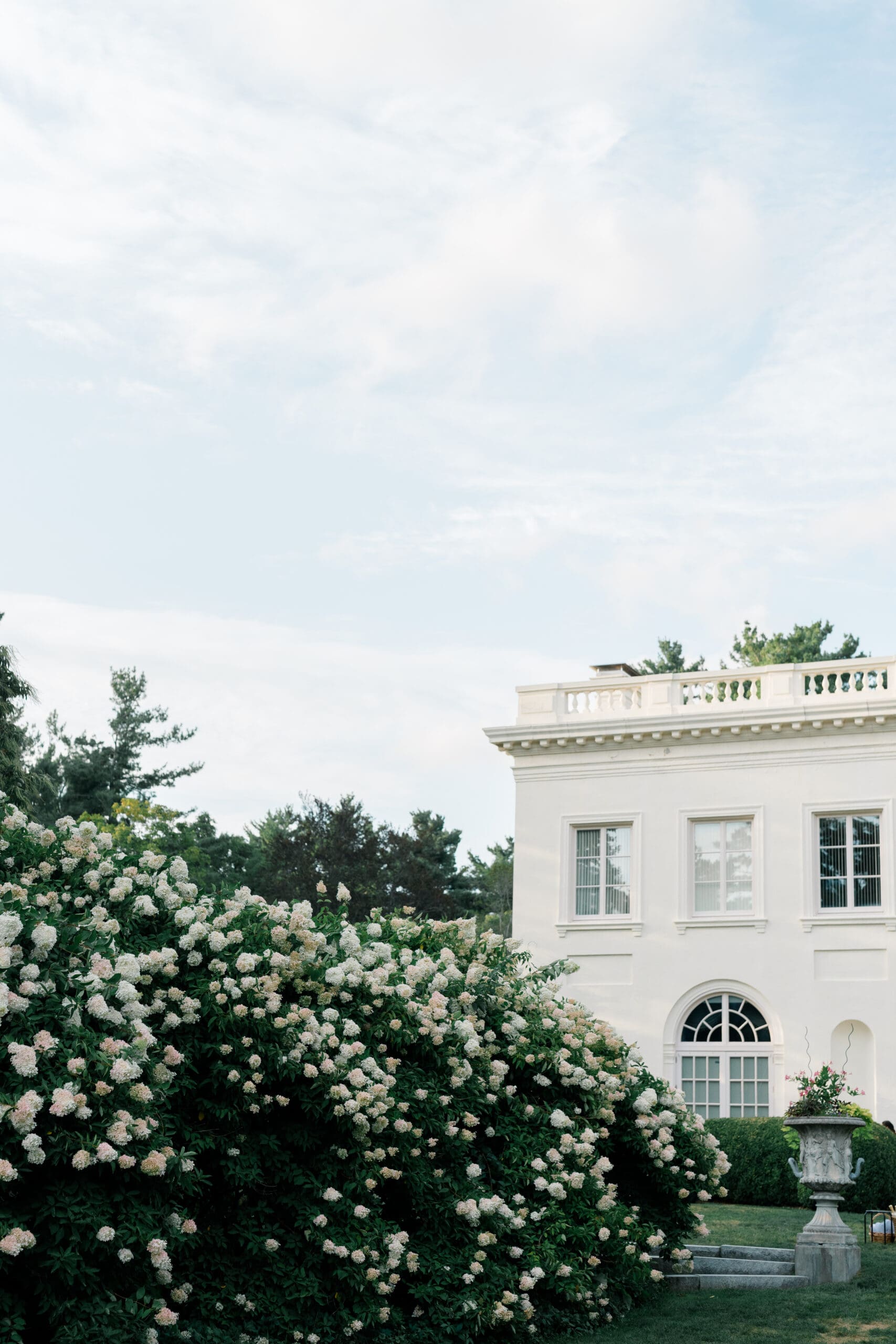 Wadsworth Mansion exterior with blooming white garden flowers at a Connecticut estate wedding venue